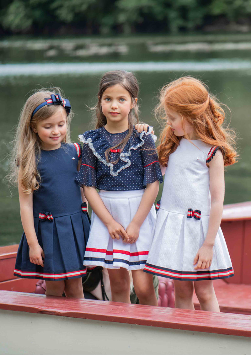 White Pique Low-Waisted Pleated Dress with Striped Ribbon Bows.