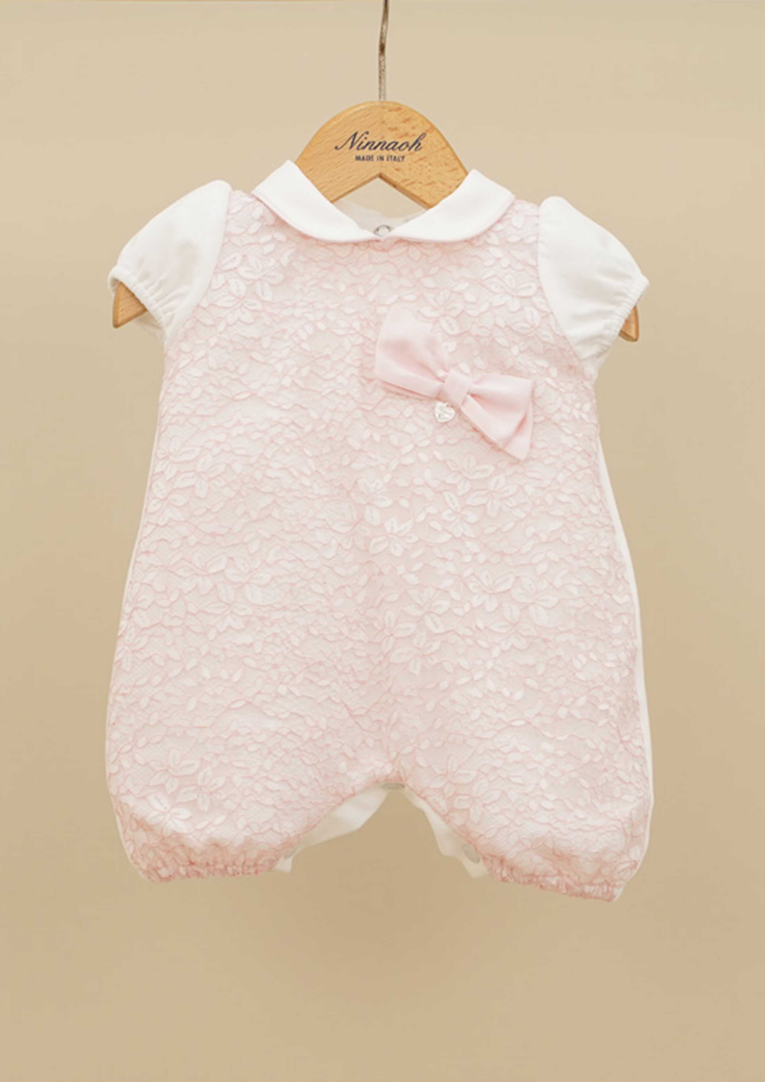 Ninnaoh pink romper with socks.